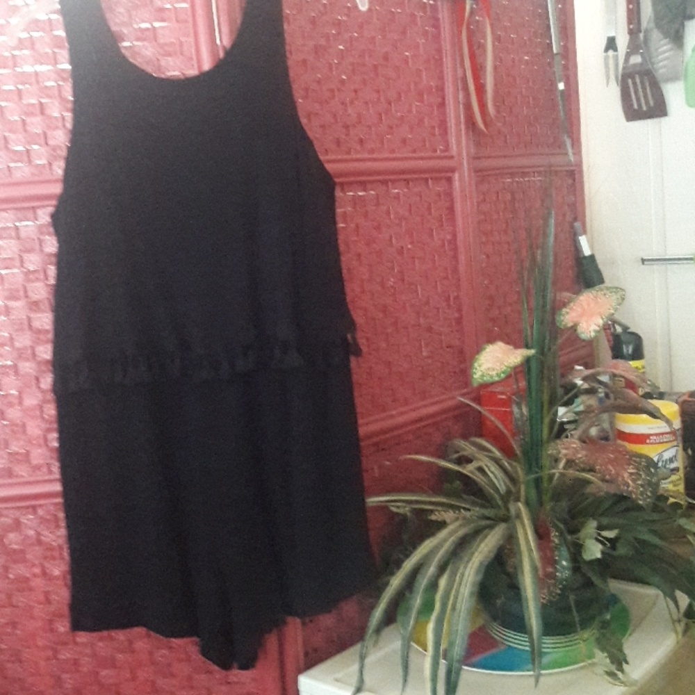 Cute Romper w/ pom pom trim . Looks like 2 pieces